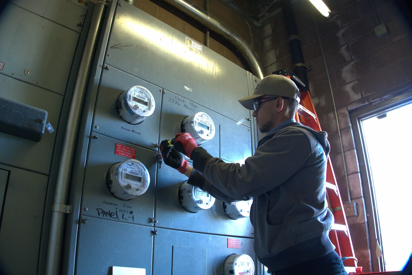 Technician performing electrical field inspection