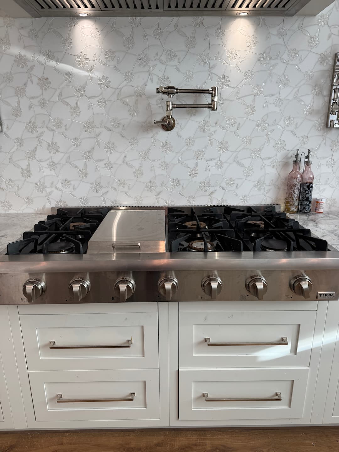 HAXX technician diagnosing cooktop repair issue