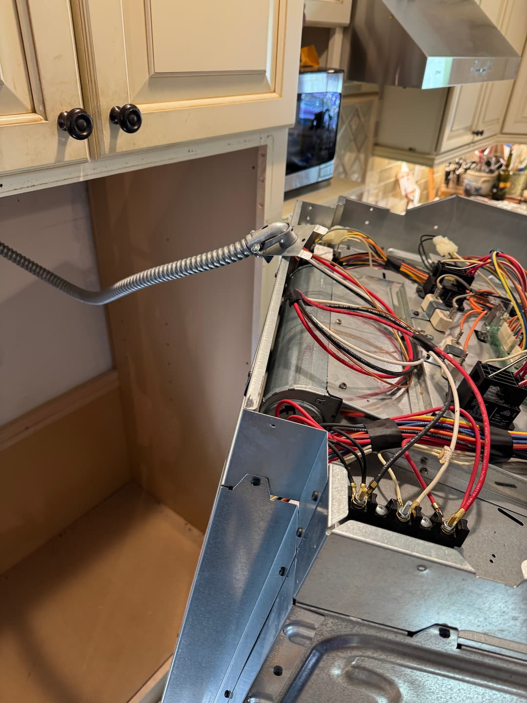 HAXX technician diagnosing electric stove repair issue