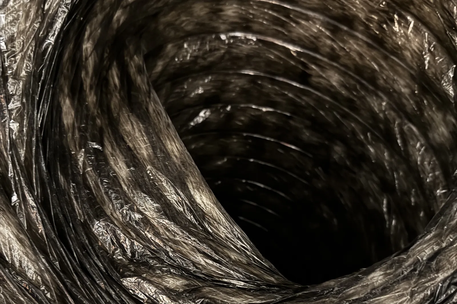 Inside view of the flexible return air duct connected to a new furnace in San Jose
