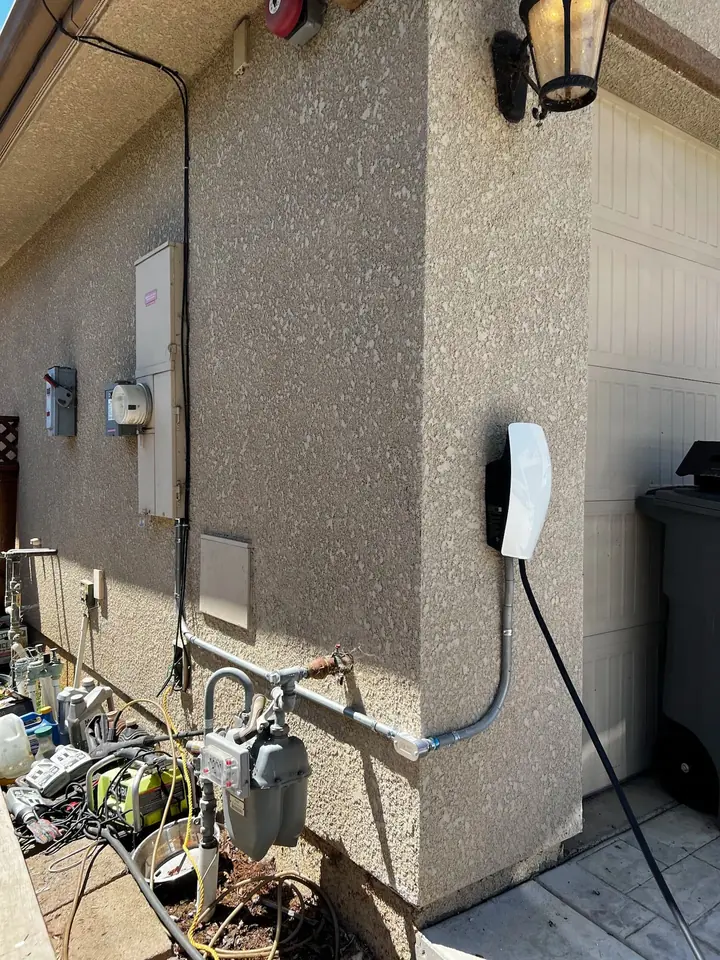 EV charger and exterior electrical panels installed by HAXX